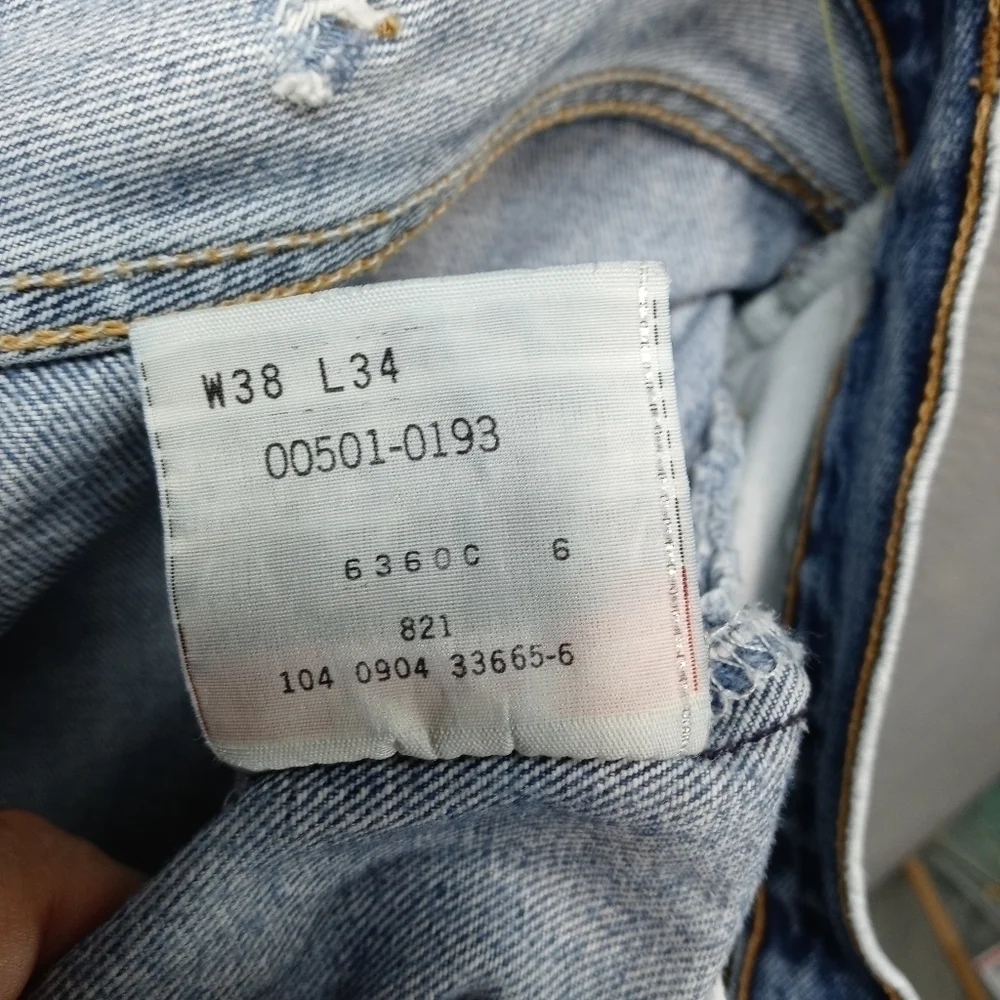 Levis 501XX men's button fly blue jeans. Sz 38x34.tear in seat. See last pic. M2